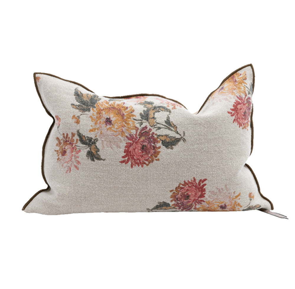 Cojín de lino beige con estampado floral y ribete oscuro, con funda anudada