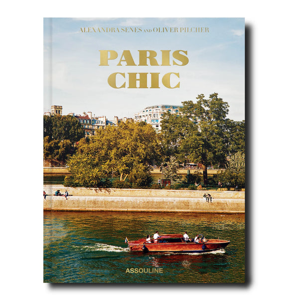 Libro Paris Chic con portada de paisaje urbano junto al río y barco rojo