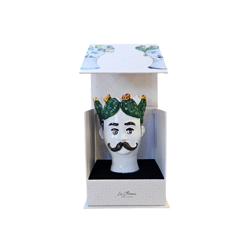 Vela decorativa con cabeza siciliana: cabello verde, bigote negro y caja