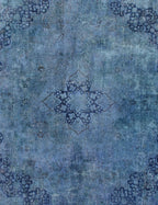 Alfombra vintage persa azul, detalle de patrón floral y arabescos en tonos oscuros