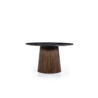 Mesa de comedor redonda con sobre de mármol oscuro y base de madera tipo pedestal.