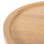 Detalle del tablero circular de roble con veta y cantos biselados