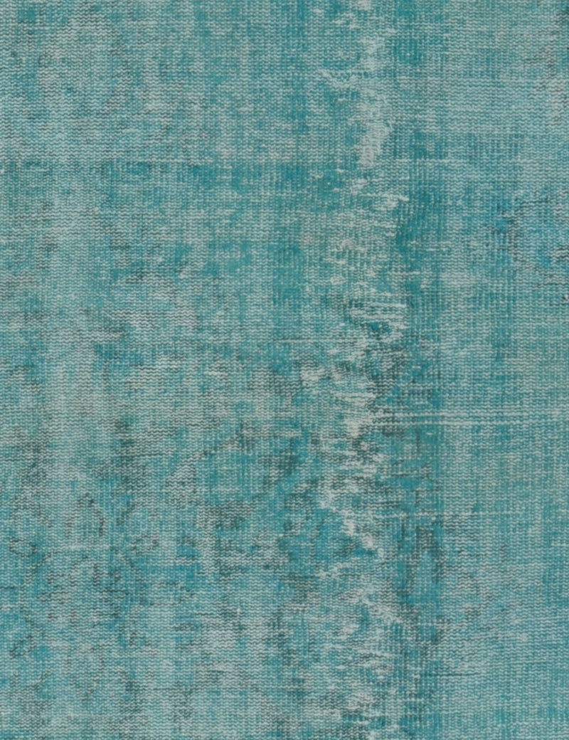 Tejido de alfombra persa turquesa con textura y vetas claras