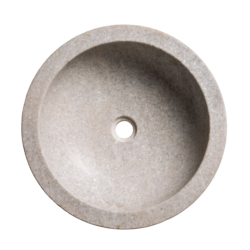 Lavabo redondo de mármol gris con orificio central para desagüe