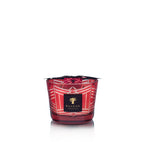 Vela en vaso de vidrio rojo con patrón blanco y etiqueta Baobab Collection