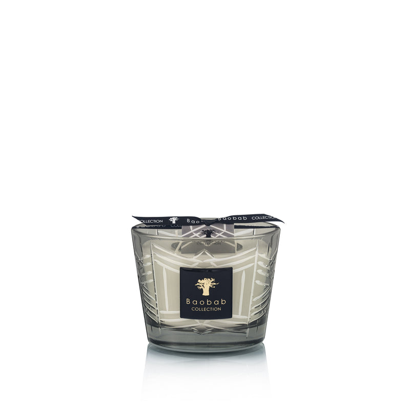 Vela en vaso de vidrio ahumado con patrón geométrico blanco y etiqueta Baobab Collection