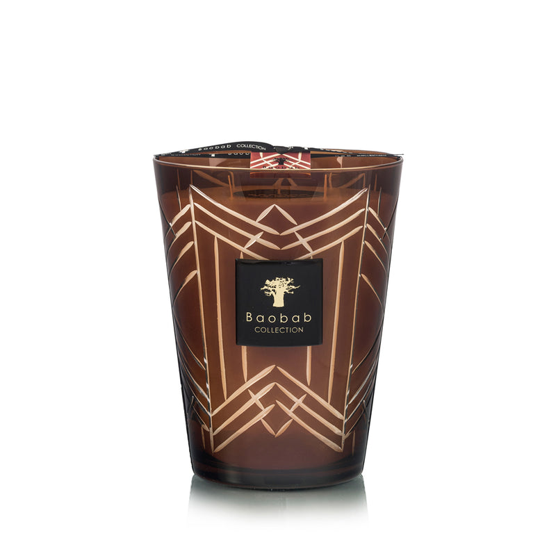 Vela en vaso de vidrio ahumado alto con patrón geométrico dorado y etiqueta Baobab