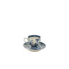 Taza de café azul con plato, diseño botánico