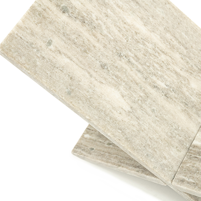 Soporte para libro de mármol crema con vetas, vista de canto y textura