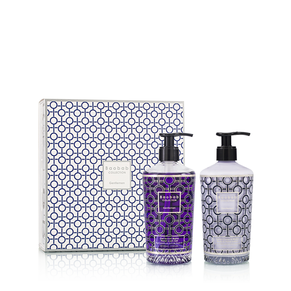 Set de gel de manos: dos botellas moradas y blancas con dosificador y caja.