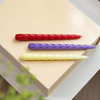 Set de 3 velas en espiral crema, roja y lila