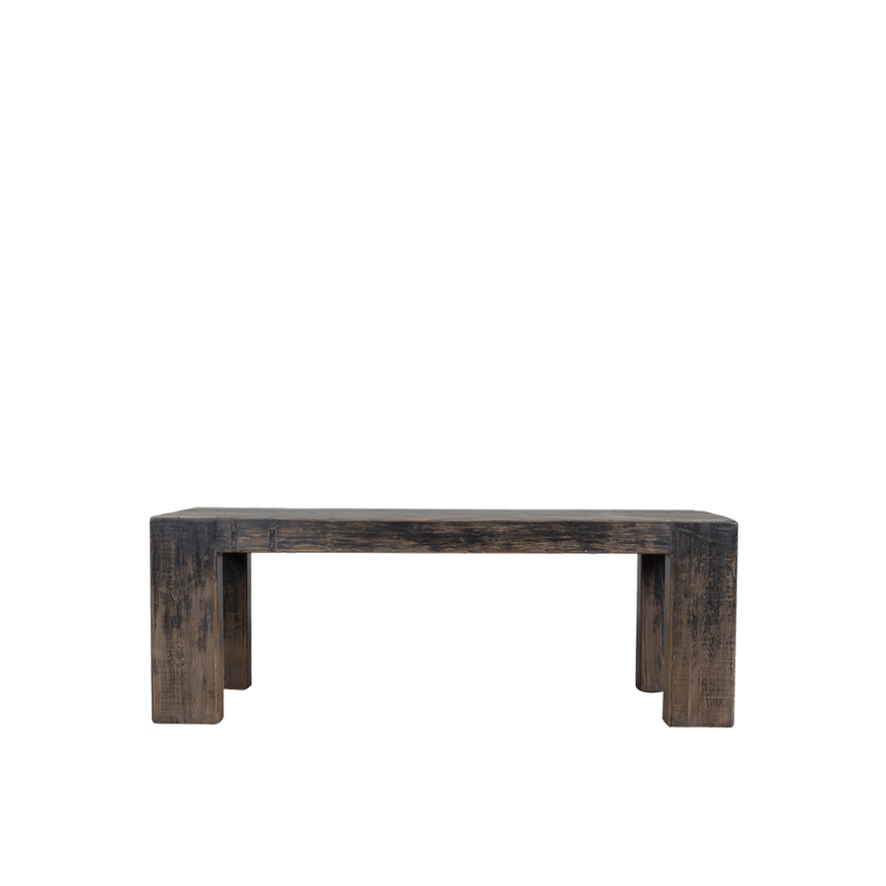 Mesa de comedor de madera oscura con patas escalonadas y acabado envejecido.