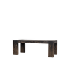 Mesa de comedor rectangular de madera oscura con patas gruesas y bastidor visible.