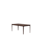 Mesa de comedor Heritage vista lateral: tablero de madera oscura y patas de soporte