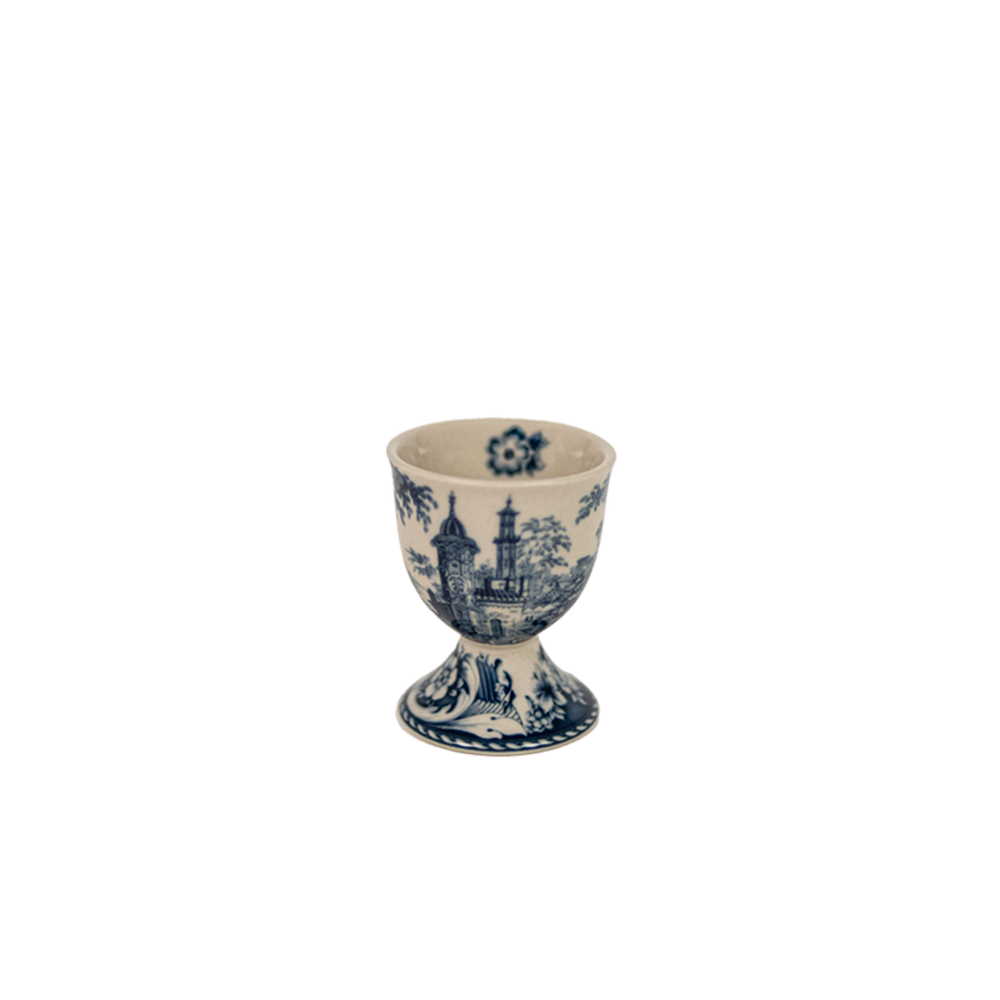 Huevera de cerámica azul y blanca con motivo de castillo, forma de copa
