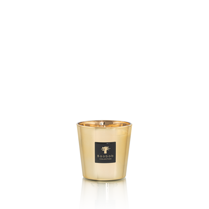 Vela en vaso metálico dorado con etiqueta Baobab Collection
