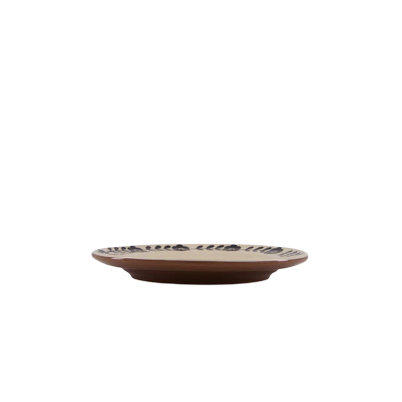 Plato llano crema con estampado negro, vista lateral del borde