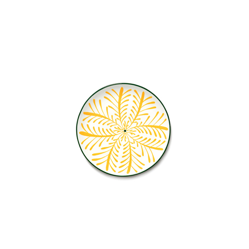 Plato de desayuno redondo amarillo con estampado floral verde y naranja