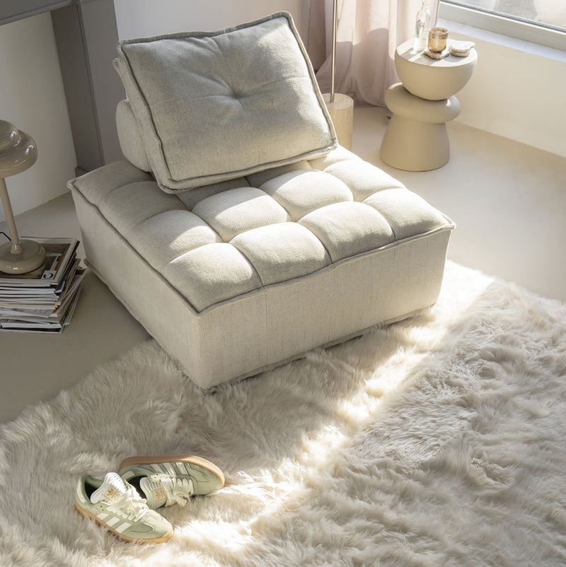 Módulo de sofá tapizado beige con respaldo reclinable y reposacabezas
