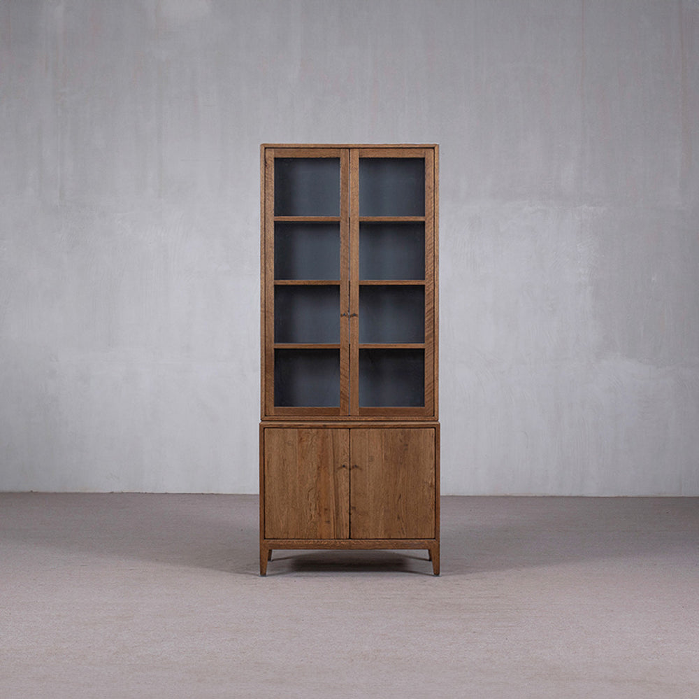 Vitrina alta de madera Heritage con puertas de vidrio y doble base abatible