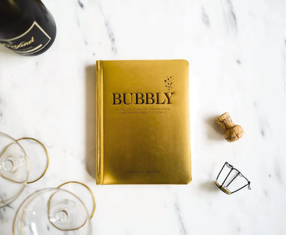 Libro Bubbly con portada dorada y título en relieve