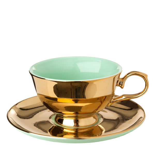 Taza de té con plato, interior verde menta y exterior dorado, con asa