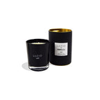 Vela en vaso negro LUZIO LUST con mecha y etiqueta blanca en el frontal