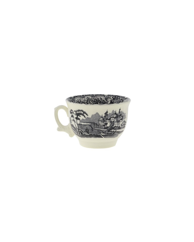 Taza de cerámica negra con asa y decoración de paisaje