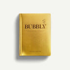 Libro Bubbly con tapa dorada y letras grandes 'BUBBLY'