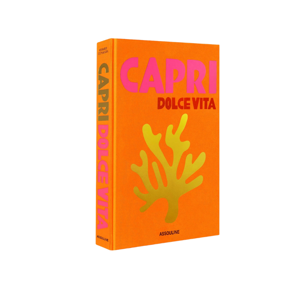 Libro Capri Dolce Vita de tapa naranja con texto CAPRI y DOLCE VITA