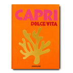 Libro Capri Dolce Vita con portada naranja y letras moradas y verdes