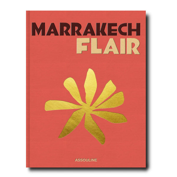 Libro Marrakech Flair con portada coral y flor amarilla estilo ilustración