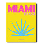Portada del libro Miami Beach: texto rosa en fondo amarillo, sol azul estilizado