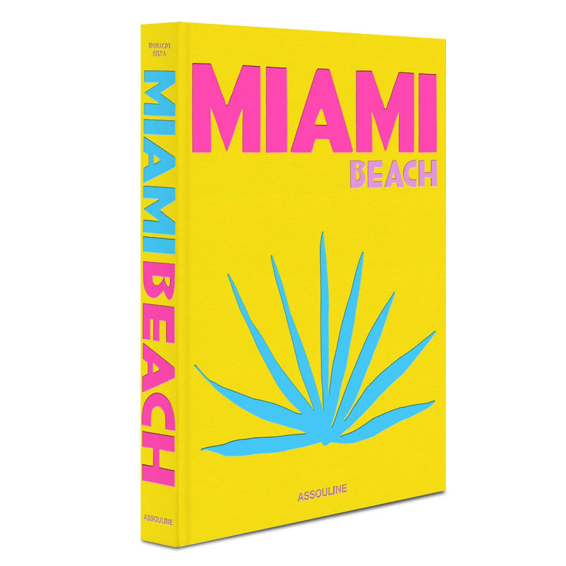 Libro Miami Beach con tapa amarilla, letras rosa y lomo con texto vertical