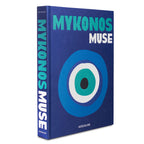 Libro de tapa azul con ojo circular y texto en el lomo, ASSOULINE
