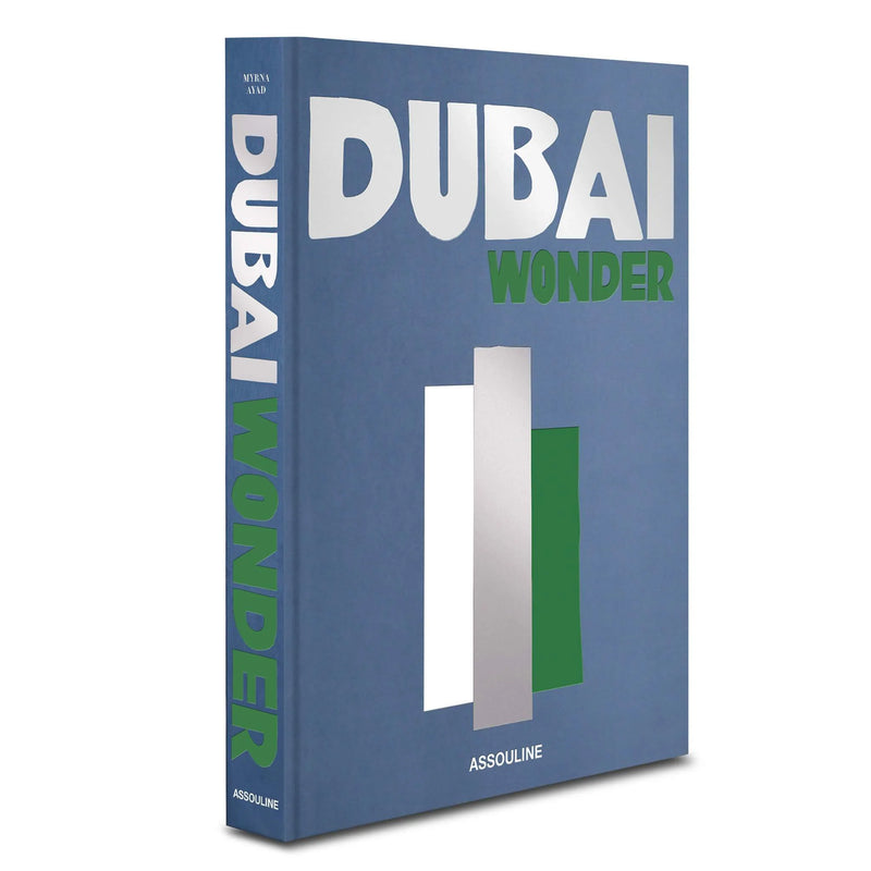 Libro Dubai Wonder azul con título DUBAI en el lateral y WONDER en verde