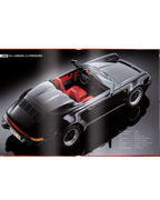 Libro Porsche 911 abierto con foto de coche negro y cabina roja