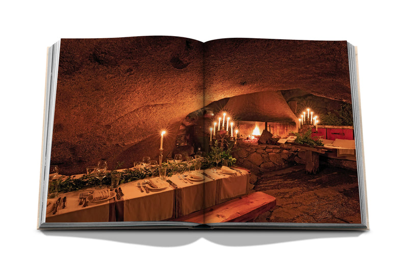 Libro de vino y viajes Francia abierto, cena con velas en bodega subterránea