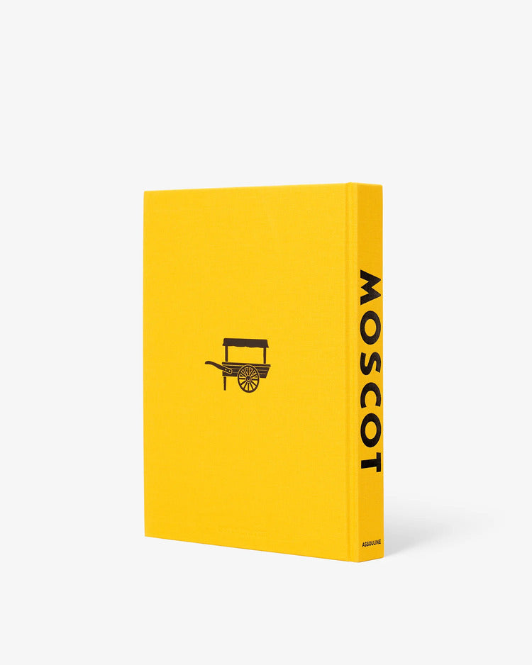 Libro de tapa trasera amarilla con icono de carro y texto vertical MOSCOT