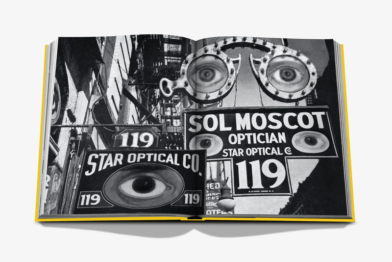 Libro abierto en blanco y negro con rótulos y gran texto SOL MOSCOT OPTICIAN