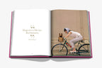 Open Chic Dogs spread with quote page left and woman riding a bike with dog on right