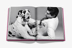 Open Chic Dogs spread: dalmatian with tied bow as a person adjusts its collar