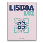 Libro Lisboa Luz, portada rosa con título azul y emblema ornamental verde y gris.