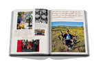 Libro abierto, fotos de barricas y viñedo con persona entre plantas