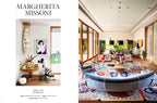 Revista con título “MARGHERITA MISSONI” y vigneta de sala blanca con plantas