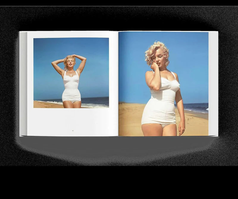 Libro abierto con fotografías a color en playa: mujer con traje blanco