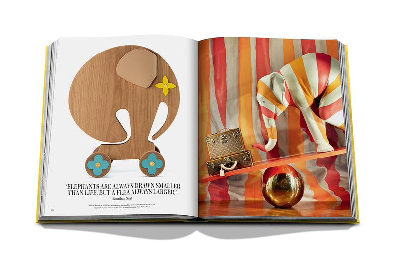 Libro abierto con ilustración de elefantes y texto en la página izquierda