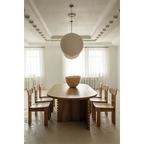 Página del libro con comedor minimalista: mesa redonda y lámpara colgante.