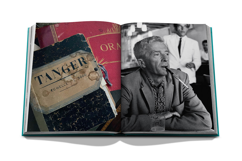 Libro abierto con retrato en blanco y negro y maleta con etiqueta Tanger