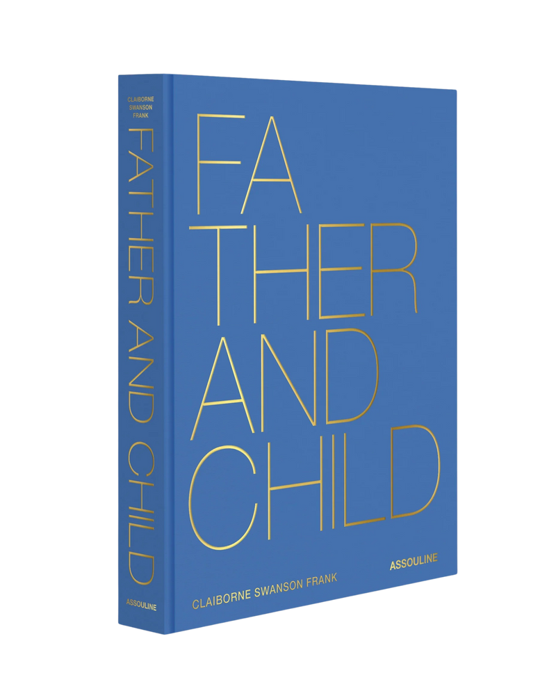 Libro de tapa azul con letras amarillas “FATHER AND CHILD” y marca Assouline
